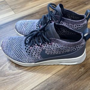 Purple Nike flyknit shoes